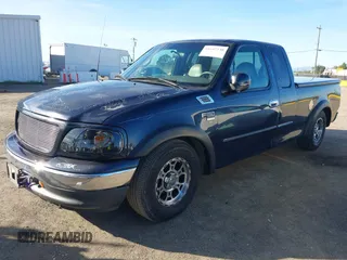 1999 Ford F-150 XL with VIN 1FTRX17L4XKA58054, listed as a IAAI auction lot 41647530 with 225,632 mi miles. Bid and sale history available at carsss.com. Image 17.