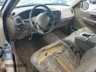 1999 Ford F-150 z VIN 1FTRX17WXXNC10010, wystawiony jako Copart lot #55607785 z przebiegiem Nie podano mil oraz Szkoda całkowita • Salvage title. Historia ofert i sprzedaży dostępna na DreamBid. Obrazek 8.