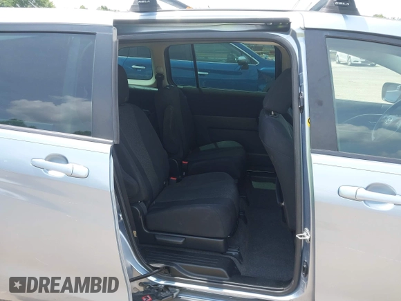 2012 Mazda 5 Sport with VIN JM1CW2BLXC0106748, listed as a IAAI auction lot 42435965 with 153,786 mi miles and . Bid and sale history available at DreamBid. Image 8.