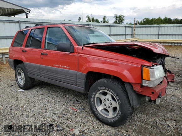 1997 Jeep Grand Cherokee Laredo with VIN 1J4GZ58S3VC739922, listed as a Copart auction lot 55667885 with 209,075 mi miles and Salvage title. Bid and sale history available at DreamBid. Image 4.