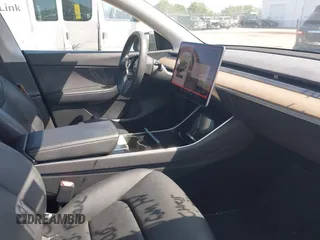 2021 Tesla Model Y Long Range with VIN 5YJYGDEE4MF076791, listed as a IAAI auction lot 41945750 with Not Provided miles and . Bid and sale history available at DreamBid. Image 5.
