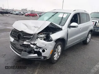 2011 Volkswagen Tiguan SEL w/Premium Navi with VIN WVGAV7AX7BW547613, listed as a IAAI auction lot 41916574 with 140,385 mi miles and . Bid and sale history available at DreamBid. Image 2.