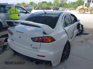 2015 Mitsubishi Lancer Evolution Final Edition with VIN JA32W7FVXFU027564, listed as a IAAI auction lot 41941191 with 52,235 mi miles. Bid and sale history available at carsss.com. Image 4.