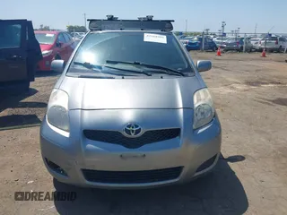 2009 Toyota Yaris with VIN JTDKT903195235991, listed as a IAAI auction lot 42164989 with 249,389 mi miles. Bid and sale history available at carsss.com. Image 6.