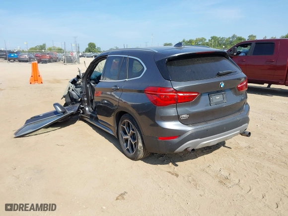 2017 BMW X1 xDrive28i with VIN WBXHT3C39H5F79706, listed as a IAAI auction lot 40168464 with 1 mi miles. Bid and sale history available at carsss.com. Image 3.