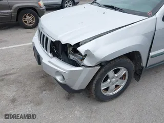 2007 Jeep Grand Cherokee Laredo with VIN 1J8GR48K47C687339, listed as a IAAI auction lot 41904034 with 158,661 mi miles. Bid and sale history available at carsss.com. Image 6.