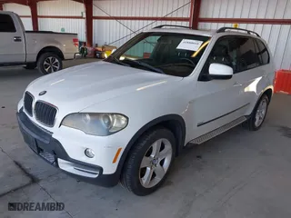 2007 BMW X5 3.0si with VIN 5UXFE43507L018015, listed as a IAAI auction lot 41880668 with 150,329 mi miles. Bid and sale history available at carsss.com. Image 2.