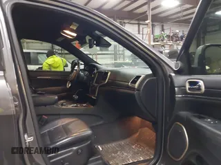 2015 Jeep Grand Cherokee Summit with VIN 1C4RJFJT6FC754799, listed as a IAAI auction lot 41699124 with 124,206 mi miles and . Bid and sale history available at DreamBid. Image 5.