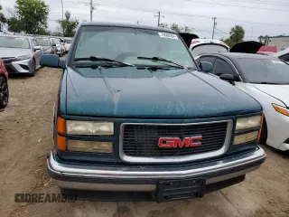 1996 GMC Suburban z VIN 1GKEC16R2TJ714191, wystawiony jako Copart lot #74660264 z przebiegiem 186 801 mil mil oraz Szkody całkowita. Historia ofert i sprzedaży dostępna na DreamBid. Obrazek 5.