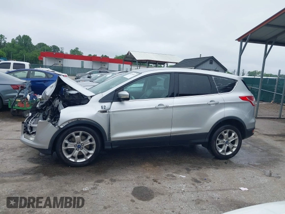 2013 Ford Escape SEL z VIN 1FMCU9H97DUA34665, wystawiony jako IAAI lot #42258567 z przebiegiem 174 227 mil mil oraz . Historia ofert i sprzedaży dostępna na DreamBid. Obrazek 14.