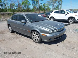 2004 Jaguar X-Type with VIN SAJEA51C04WD73023, listed as a IAAI auction lot 41874488 with 199,333 mi miles. Bid and sale history available at carsss.com. Image 1.