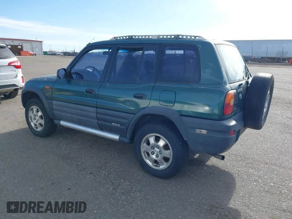 1997 Toyota RAV4 with VIN JT3HP10V2V0147285, listed as a IAAI auction lot 41856796 with 303,535 mi miles and . Bid and sale history available at DreamBid. Image 3.