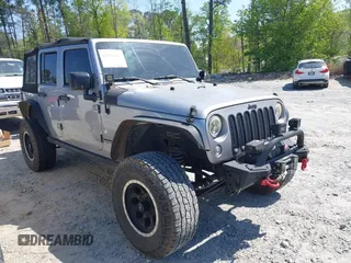 2014 Jeep Wrangler Unlimited Sport with VIN 1C4BJWDG4EL292421, listed as a IAAI auction lot 42034343 with 157,820 mi miles. Bid and sale history available at carsss.com. Image 1.