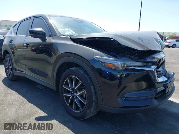 2018 Mazda CX-5 Grand Touring z VIN JM3KFADM7J0327272, wystawiony jako IAAI lot #42279536 z przebiegiem 97 478 mil mil oraz . Historia ofert i sprzedaży dostępna na DreamBid. Obrazek 1.
