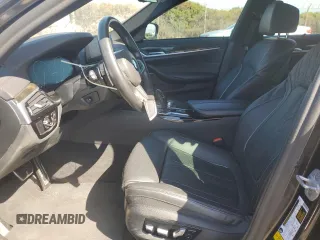 2019 BMW 5 Series M550i xDrive with VIN WBAJB9C57KB289036, listed as a Copart auction lot 86292134 with 28,103 mi miles and Salvage title. Bid and sale history available at DreamBid. Image 7.