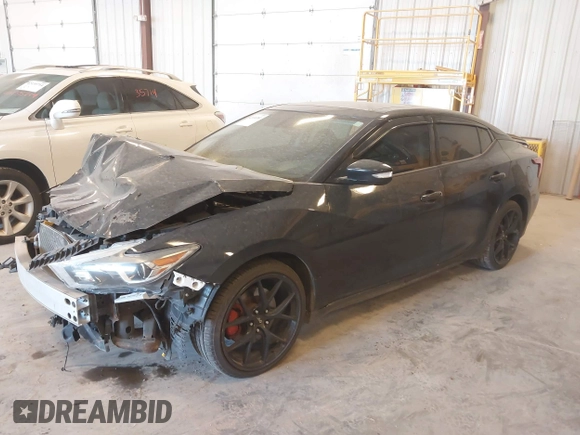 2016 Nissan Maxima SL z VIN 1N4AA6AP6GC393291, wystawiony jako IAAI lot #42104381 z przebiegiem 88 154 mil mil oraz . Historia ofert i sprzedaży dostępna na DreamBid. Obrazek 17.