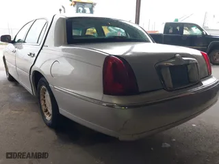 2002 Lincoln Town Car Executive with VIN 1LNHM81W42Y608998, listed as a IAAI auction lot 42096798 with 222,672 mi miles. Bid and sale history available at carsss.com. Image 3.