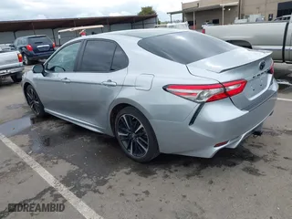 2018 Toyota Camry LE with VIN 4T1B11HK0JU129623, listed as a IAAI auction lot 41902335 with 100,643 mi miles. Bid and sale history available at carsss.com. Image 3.