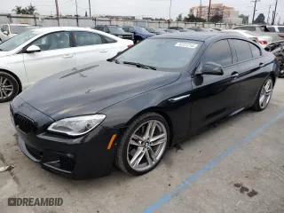 2015 BMW 6 Series 650i with VIN WBA6B2C59FD799296, listed as a Copart auction lot 76727214 with 85,806 mi miles and Salvage Title. Bid and sale history available at carsss.com. Image 1.