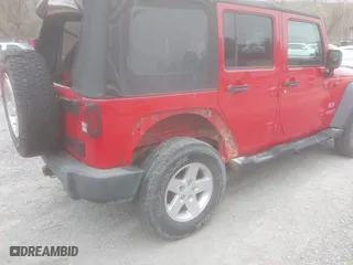 2008 Jeep Wrangler Unlimited X with VIN 1J8GA39128L562347, listed as a IAAI auction lot 41912669 with 106,040 mi miles. Bid and sale history available at carsss.com. Image 4.