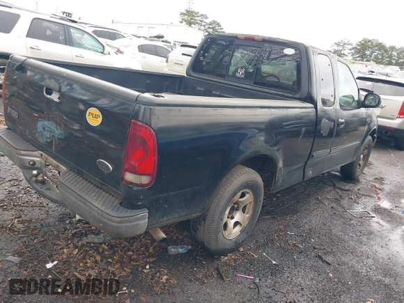 2002 Ford F-150 XL with VIN 1FTRX17252NA19861, listed as a IAAI auction lot 41304648 with 279,277 mi miles. Bid and sale history available at carsss.com. Image 4.