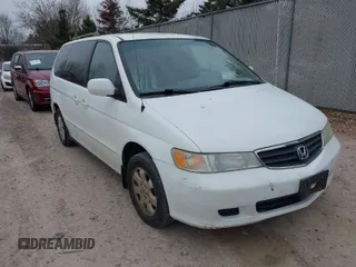 2004 Honda Odyssey EX-RES z VIN 5FNRL18864B108886, wystawiony jako IAAI lot #42051458 z przebiegiem 186 922 mil mil oraz . Historia ofert i sprzedaży dostępna na DreamBid. Obrazek 1.