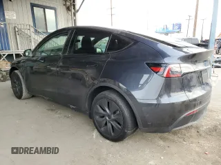 2025 Tesla Model Y Long Range with VIN 7SAYGDED8SF218700, listed as a Copart auction lot 84720474 with 1,832 mi miles and Salvage Title. Bid and sale history available at DreamBid. Image 2.