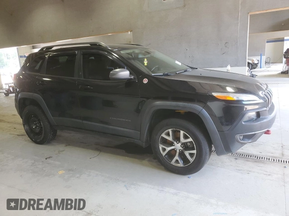 2014 Jeep Cherokee Trailhawk with VIN 1C4PJMBB8EW171116, listed as a Copart auction lot 60107215 with 168,979 mi miles and Salvage title. Bid and sale history available at DreamBid. Image 4.