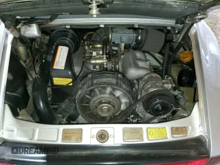 1988 Porsche 911 z VIN WP0EB0913JS161203, wystawiony jako Copart lot #71547754 z przebiegiem 109 128 mil mil oraz Szkoda całkowita • Salvage title. Historia ofert i sprzedaży dostępna na DreamBid. Obrazek 11.