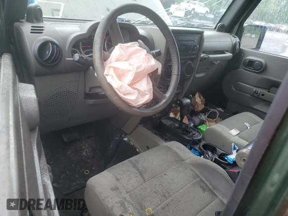 2007 Jeep Wrangler Unlimited Sahara с VIN 1J4GA59107L141710, выставлен на аукционе Copart как лот 59939755 с пробегом 212 659 миль миль и Списание • Salvage title. История ставок и продаж доступна на DreamBid. Изображение 8.