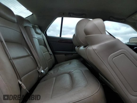 2004 Cadillac DeVille z VIN 1G6KD54Y64U134605, wystawiony jako Copart lot #56258215 z przebiegiem 256 662 mil mil oraz Szkody całkowita. Historia ofert i sprzedaży dostępna na DreamBid. Obrazek 11.