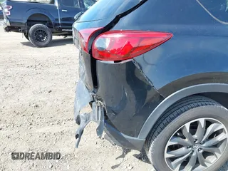 2016 Mazda CX-5 Grand Touring with VIN JM3KE4DY8G0639570, listed as a IAAI auction lot 42098512 with 126,541 mi miles and . Bid and sale history available at carsss.com. Image 18.