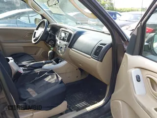 2006 Mazda Tribute LX with VIN 4F2YZ94136KM23037, listed as a IAAI auction lot 42220090 with 144,039 mi miles and . Bid and sale history available at carsss.com. Image 5.