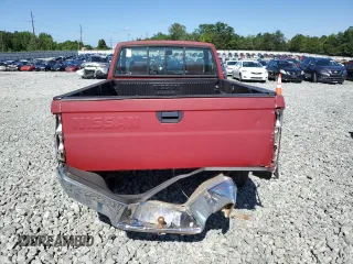 1991 Nissan Frontier XE with VIN 1N6SD11S2MC412375, listed as a Copart auction lot 61015515 with 201,629 mi miles and Salvage title. Bid and sale history available at DreamBid. Image 6.