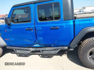 2023 Jeep Gladiator Rubicon with VIN 1C6JJTBG3PL581023, listed as a IAAI auction lot 41963931 with 15,023 mi miles and . Bid and sale history available at DreamBid. Image 15.