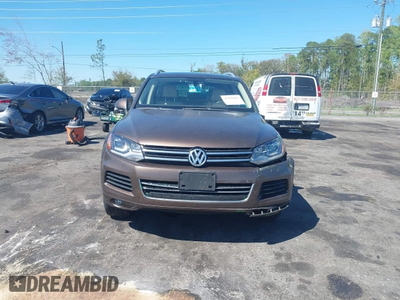 2014 Volkswagen Touareg Sport with VIN WVGEF9BP7ED003525, listed as a IAAI auction lot 41868307 with 74,379 mi miles and . Bid and sale history available at DreamBid. Image 12.