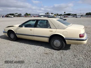 1992 Cadillac Seville z VIN 1G6KS53B0NU837105, wystawiony jako Copart lot #55865205 z przebiegiem 94 740 mil mil oraz Szkody całkowita. Historia ofert i sprzedaży dostępna na DreamBid. Obrazek 2.