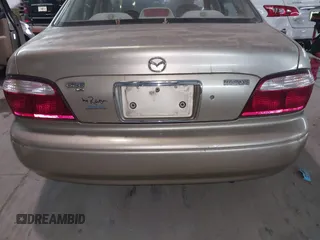 1999 Mazda 626 ES with VIN 1YVGF22C9X5823002, listed as a IAAI auction lot 41385617 with 149,127 mi miles. Bid and sale history available at carsss.com. Image 15.