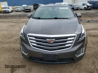 2019 Cadillac XT5 Luxury FWD with VIN 1GYKNCRSXKZ132871, listed as a Copart auction lot 54879405 with 57,325 mi miles and Salvage title. Bid and sale history available at DreamBid. Image 5.