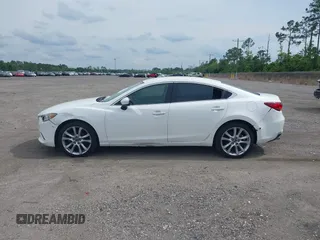 2014 Mazda 6 i Touring with VIN JM1GJ1V64E1142643, listed as a IAAI auction lot 42229322 with 215,095 mi miles and . Bid and sale history available at DreamBid. Image 14.