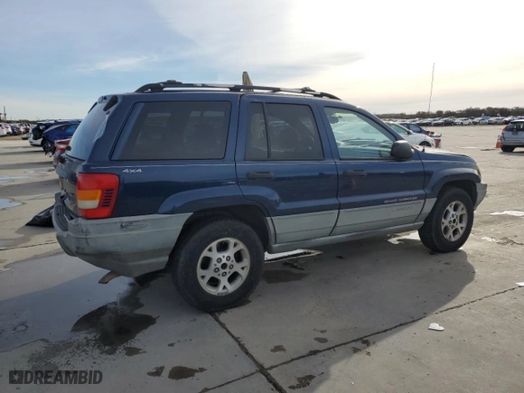 1999 Jeep Grand Cherokee Laredo with VIN 1J4GW58S0XC653687, listed as a Copart auction lot 81166844 with 252,330 mi miles and Salvage Title. Bid and sale history available at carsss.com. Image 3.