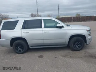 2015 Chevrolet Tahoe Commercial with VIN 1GNSK2ECXFR681555, listed as a IAAI auction lot 41975359 with 126,785 mi miles. Bid and sale history available at carsss.com. Image 13.