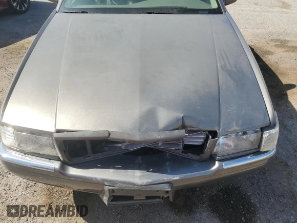 1998 Cadillac Eldorado z VIN 1G6EL12YXWU610918, wystawiony jako Copart lot #57309075 z przebiegiem 168 228 mil mil oraz Szkoda całkowita • Salvage title. Historia ofert i sprzedaży dostępna na DreamBid. Obrazek 11.