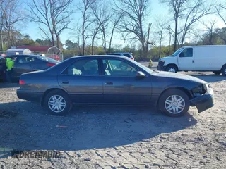 2001 Toyota Camry CE with VIN 4T1BG22K41U842473, listed as a IAAI auction lot 41858322 with 203,696 mi miles. Bid and sale history available at carsss.com. Image 13.