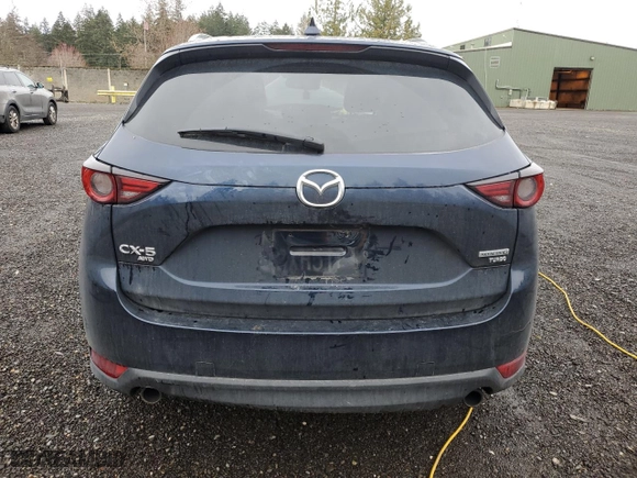2021 Mazda CX-5 Grand Touring Reserve with VIN JM3KFBAY3M0327707, listed as a Copart auction lot 49733255 with 34,084 mi miles and Salvage Title. Bid and sale history available at carsss.com. Image 6.