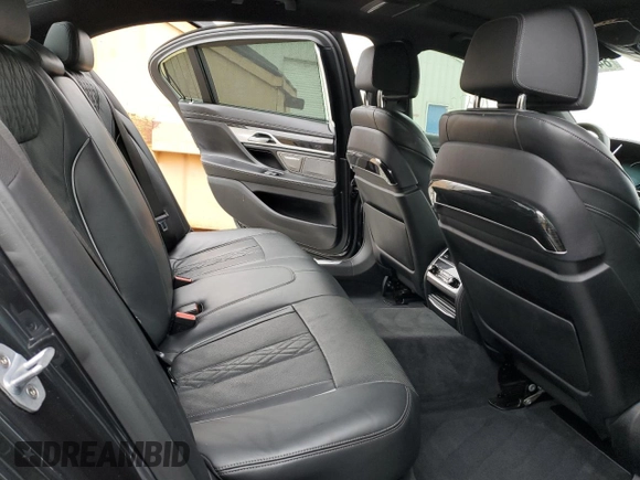 2019 BMW 7 Series 750i with VIN WBA7F0C54KGM25281, listed as a Copart auction lot 84741334 with 76,472 mi miles and Salvage Title. Bid and sale history available at carsss.com. Image 10.