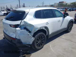 2024 Mazda CX-50 S Select with VIN 7MMVABAM6RN215530, listed as a IAAI auction lot 42250974 with 9,940 mi miles and . Bid and sale history available at DreamBid. Image 4.
