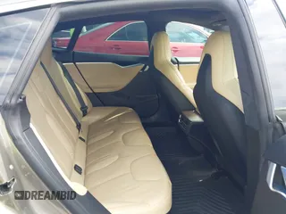 2015 Tesla Model S 85 with VIN 5YJSA1E14FF120455, listed as a IAAI auction lot 42053306 with 62,817 mi miles and . Bid and sale history available at DreamBid. Image 8.