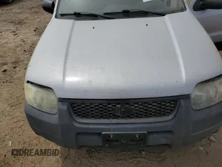 2004 Ford Escape XLS с VIN 1FMYU02134KA88982, выставлен на аукционе Copart как лот 57037915 с пробегом 195 423 миль миль и Списание • Salvage title. История ставок и продаж доступна на DreamBid. Изображение 12.