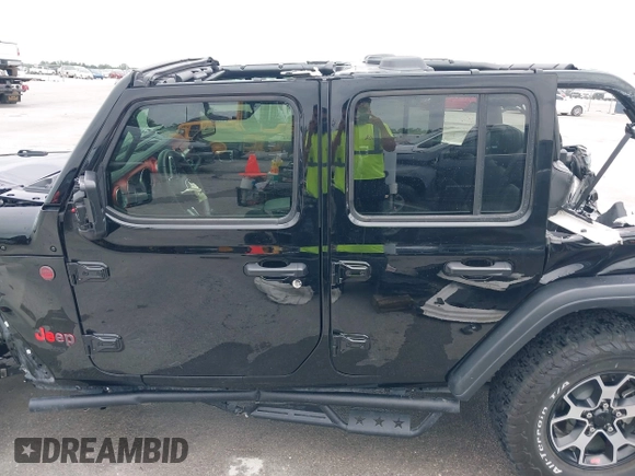 2021 Jeep Wrangler Unlimited Rubicon with VIN 1C4HJXFG7MW662092, listed as a IAAI auction lot 42139521 with 32,055 mi miles and . Bid and sale history available at DreamBid. Image 14.